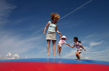 Image showing Family jumping