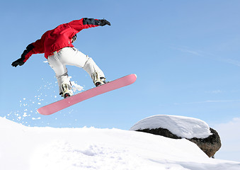 Image showing Snowboarder jumping