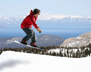 Image showing Snowboarder jumping