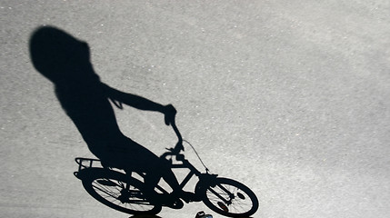 Image showing shade of child on a bike