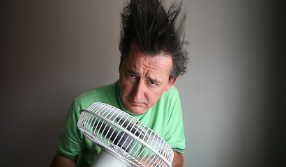 Image showing Man with hair dryer