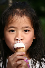 Image showing child eating ice