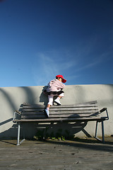 Image showing child  climbing at a bench