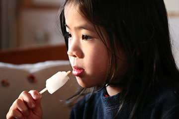 Image showing child eating ice