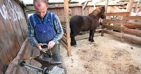 Image showing Blacksmith at work