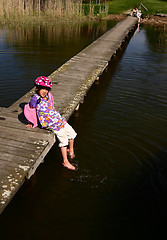 Image showing Child playing at the lake