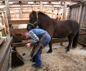 Image showing Blacksmith at work