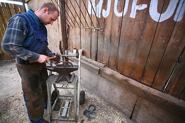 Image showing Blacksmith at work