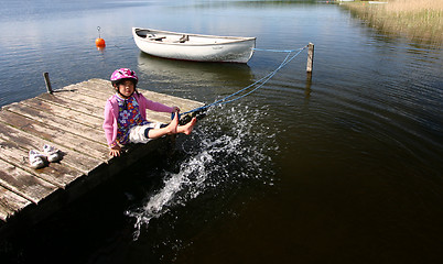 Image showing Child playing at the lake