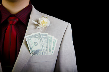 Image showing dollars in the pocket of the groom's wedding suit