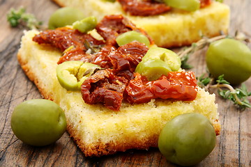 Image showing Bread with olives, sun dried tomatoes and thyme.