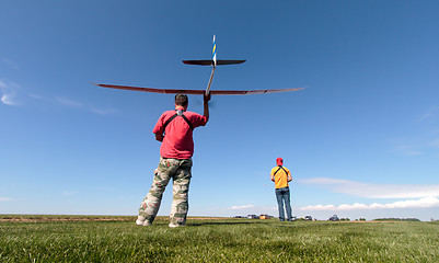 Image showing Man launches into the sky RC glider