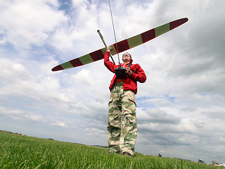 Image showing Man launches into the sky RC glider