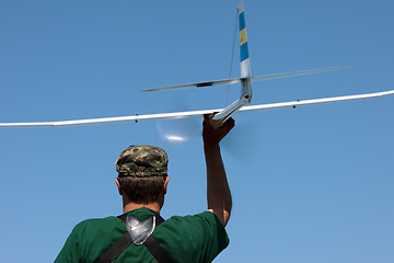 Image showing Man launches into the sky RC glider