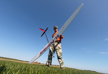 Image showing Man holds the RC glider