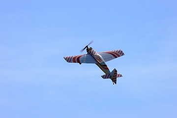 Image showing RC model airplane flying in the blue sky