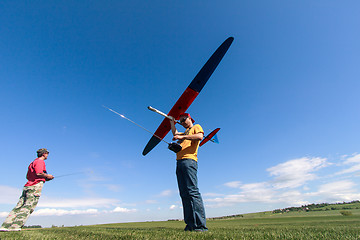 Image showing Man launches into the sky RC glider