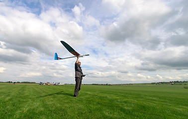 Image showing Man launches into the sky RC glider