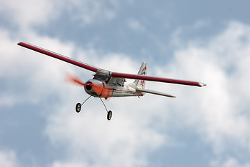 Image showing RC model airplane flying in the blue sky