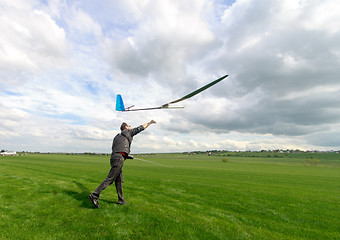 Image showing Man launches into the sky RC glider