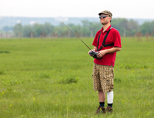 Image showing Man controls RC glider