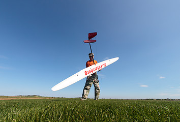 Image showing Man holds the RC glider