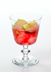 Image showing red cold drink with ice and lime