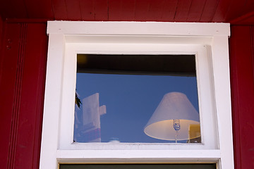 Image showing Close up on a Window with Lamp inside