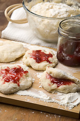 Image showing Dough with marmelade on wooden board