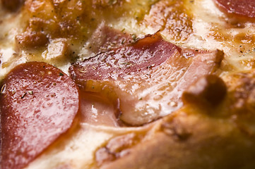 Image showing Italian pizza with bacon, salami and mozzarella cheese