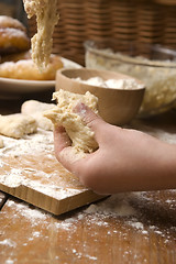 Image showing Detail of hands kneading dough