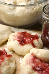 Image showing Dough with marmelade on wooden board