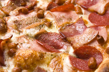 Image showing Italian pizza with bacon, salami and mozzarella cheese