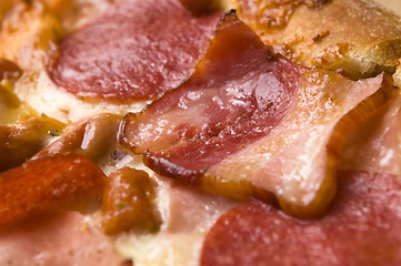 Image showing Italian pizza with bacon, salami and mozzarella cheese