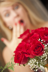 Image showing Blonde Woman Accepts Gift of Red Roses