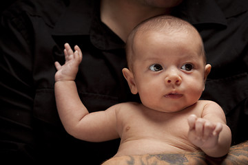 Image showing Young Father Holding His Mixed Race Newborn Baby