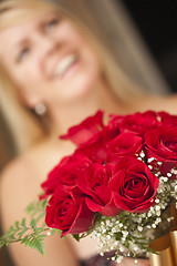 Image showing Blonde Woman Accepts Gift of Red Roses