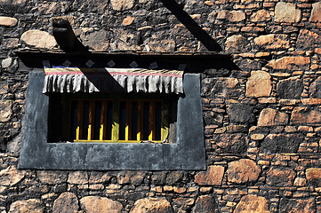 Image showing Typical Tibetan window and rock wall