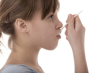 Image showing Girl with spoon on white