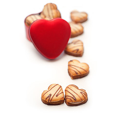 Image showing heart shaped cream cookies on red heart metal box