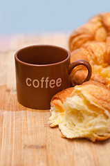 Image showing fresh baked french croissant brioche on wood board