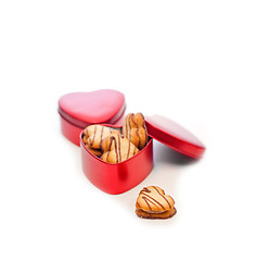 Image showing heart shaped cream cookies on red heart metal box