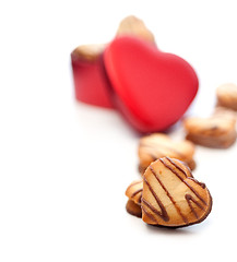 Image showing heart shaped cream cookies on red heart metal box