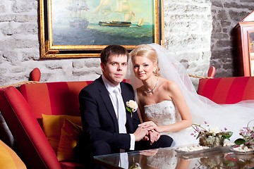 Image showing beautiful groom and bride in interior