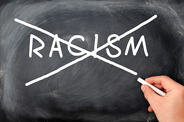 Image showing Crossing out racism on a blackboard