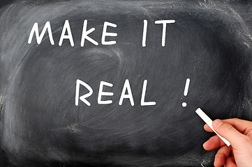 Image showing Make it real with a hand holding chalk