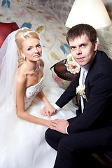 Image showing beautiful groom and bride in interior