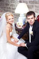 Image showing beautiful groom and bride in interior