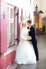 Image showing beautiful groom and the bride on the street of old town