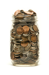 Image showing Glass jar overflowing with American coins
